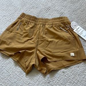 Brand new with tags Vuori– short in a dark golden color size medium